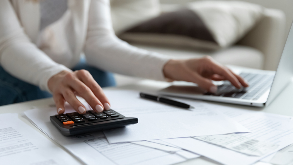 woman calculating taxes at desk