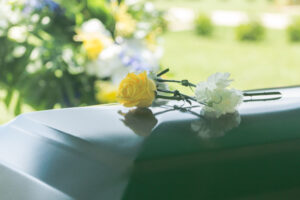 The photo shows a funeral casket before a Hampton wrongful death lawyer is contacted.