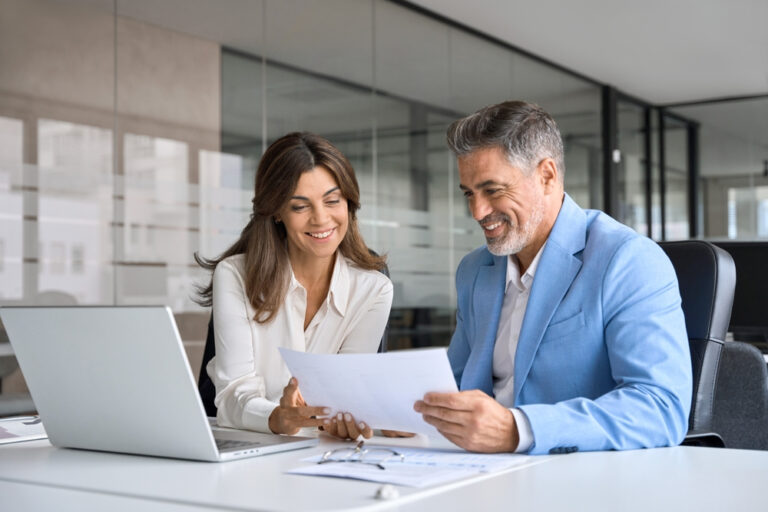 A lawyer consults with a client. Learn about how to choose the best pedestrian accident lawyer.